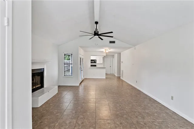 a view of a kitchen with a sink and a stove top oven