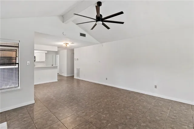a view of a kitchen with a sink and cabinets
