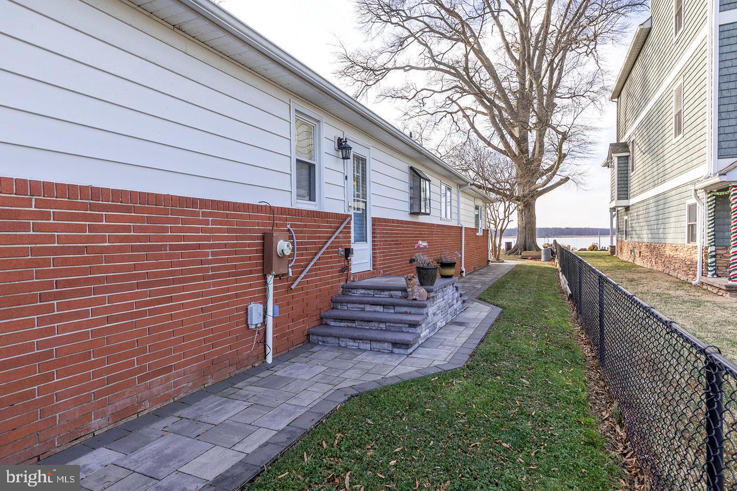 13202 Cherwin Avenue Baltimore, MD 21220 - Photo 35 of 50 Custom Inlaid Brick Side walkway & Porch