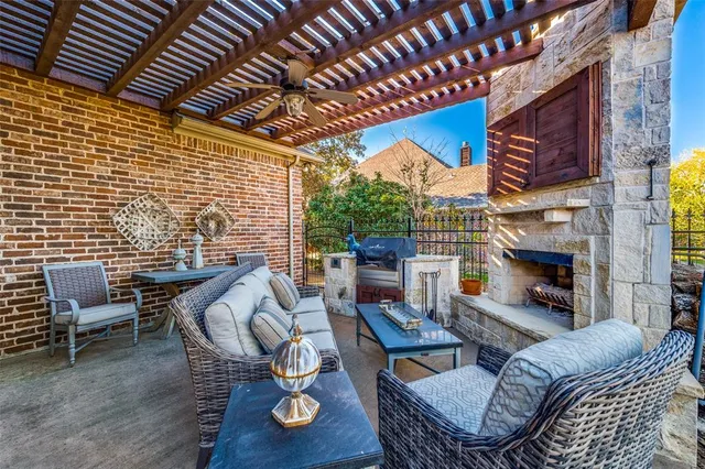 a living room with furniture a fireplace a rug and a table