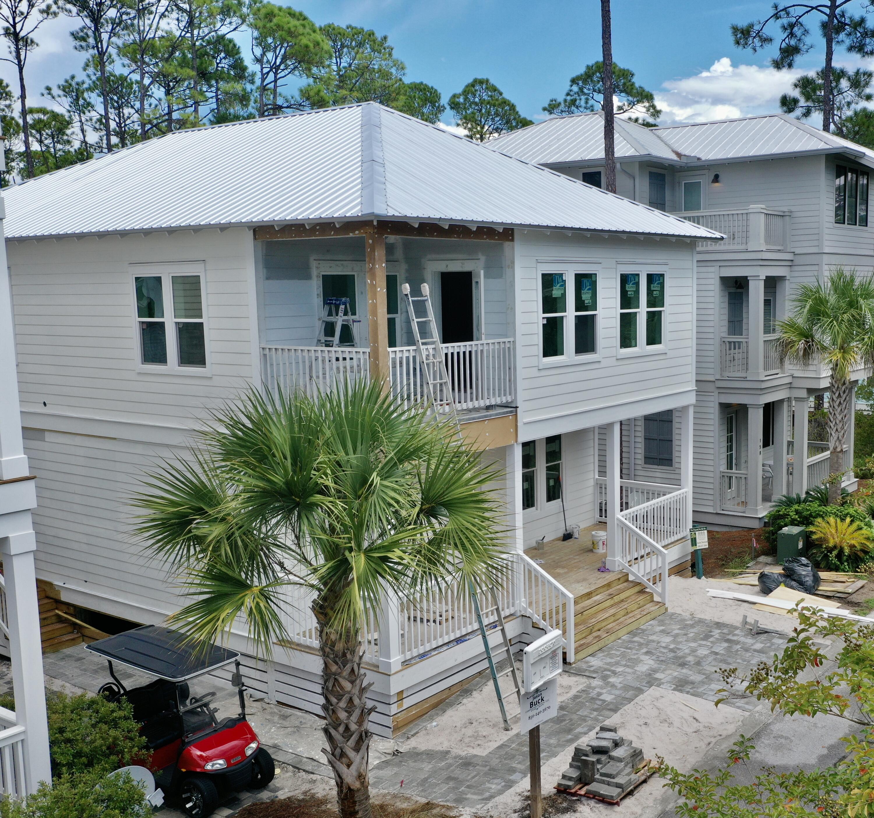 Lot 75 Red Bud Inlet Beach Inlet Beach, FL 32461 - Photo 1 of 8 a front view of a house with garden