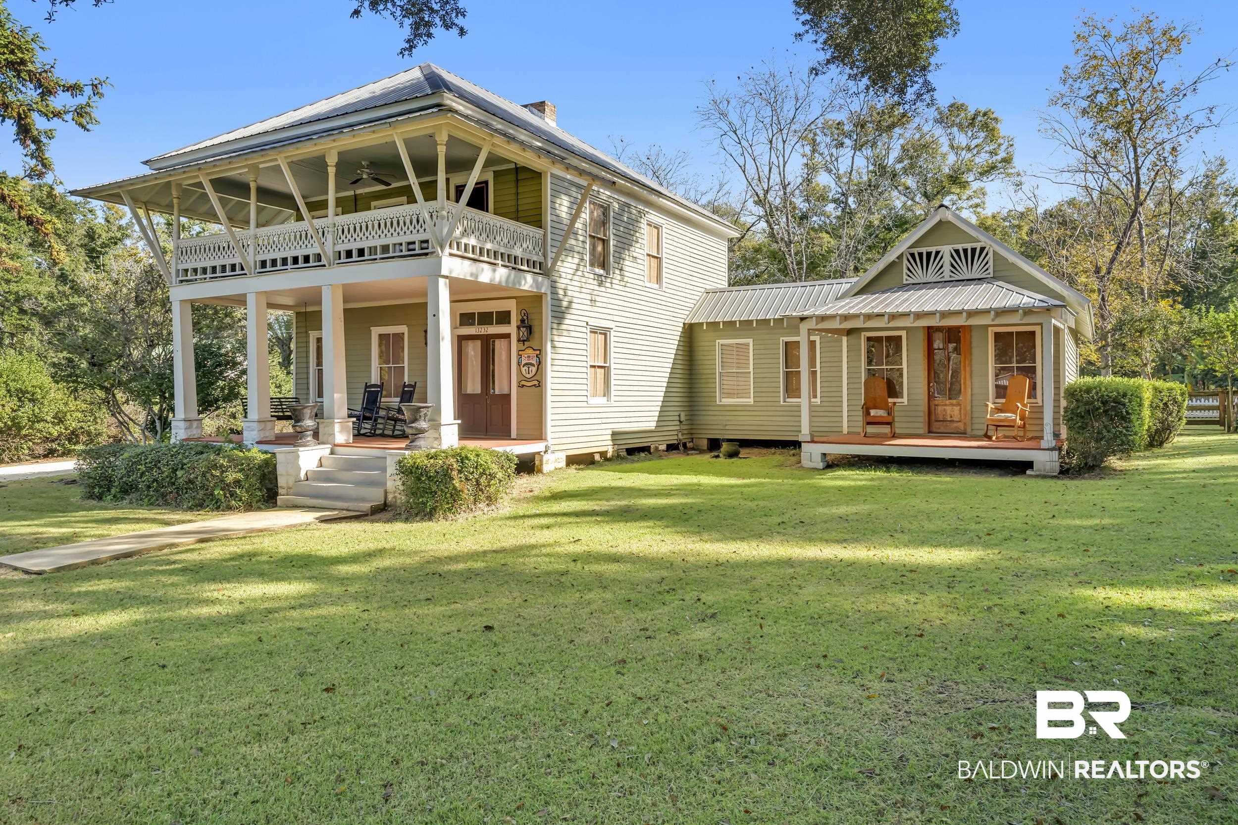13232 Mary Ann Bch Road Fairhope, AL 36532 - Photo 76 of 79 Rear view of house with covered porch and a lawn