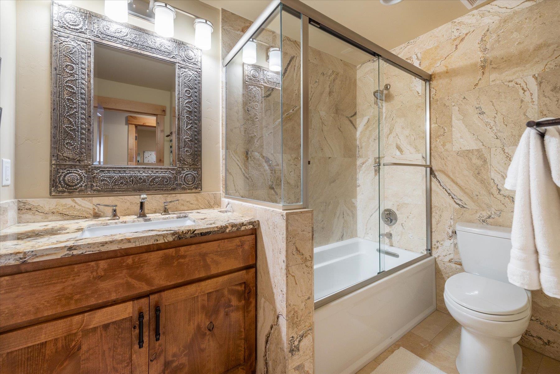 14791 Tyrol Road Truckee, CA 96161 - Photo 16 of 24 a bathroom with a granite countertop sink toilet and shower
