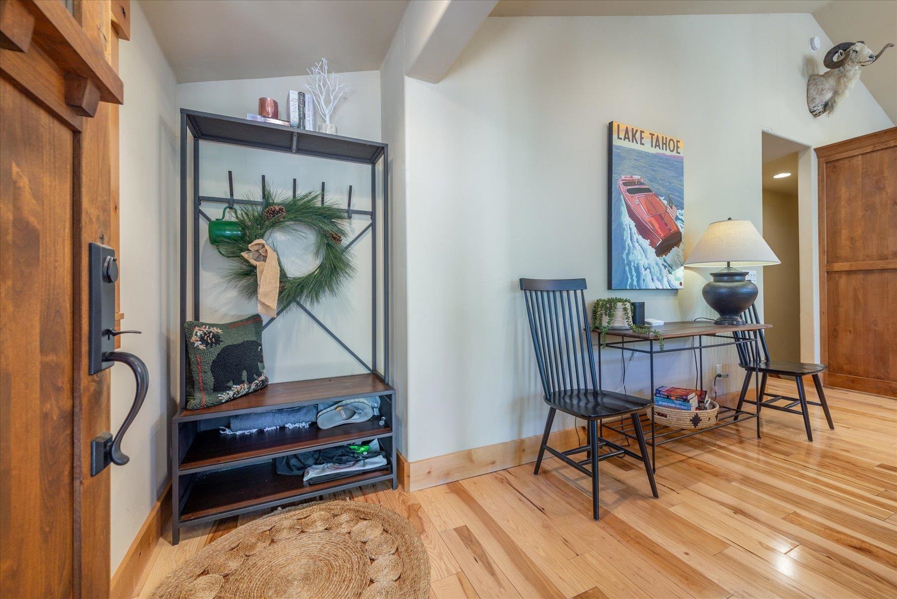 14791 Tyrol Road Truckee, CA 96161 - Photo 3 of 24 a living room with furniture and a painting on the wall