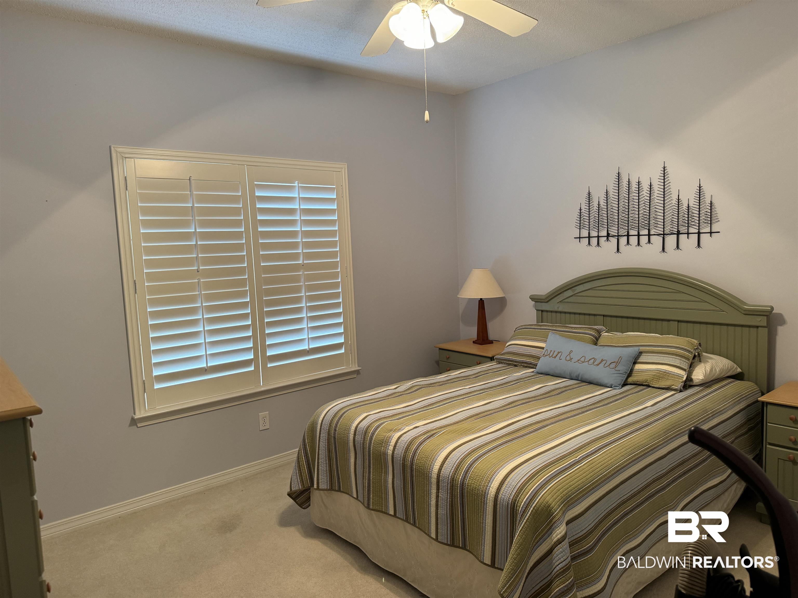 9139 Clubhouse Drive Foley, AL 36535 - Photo 26 of 30 Carpeted bedroom featuring multiple windows and ceiling fan