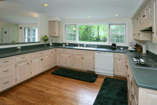 Undisclosed Address Darien, CT 06820 - Photo 2 of 4 a kitchen with granite countertop a sink stainless steel appliances and cabinets