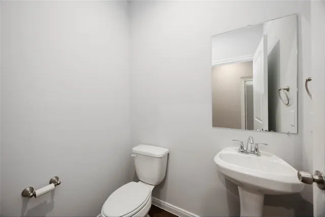 a view of a room with wooden floor fan and window