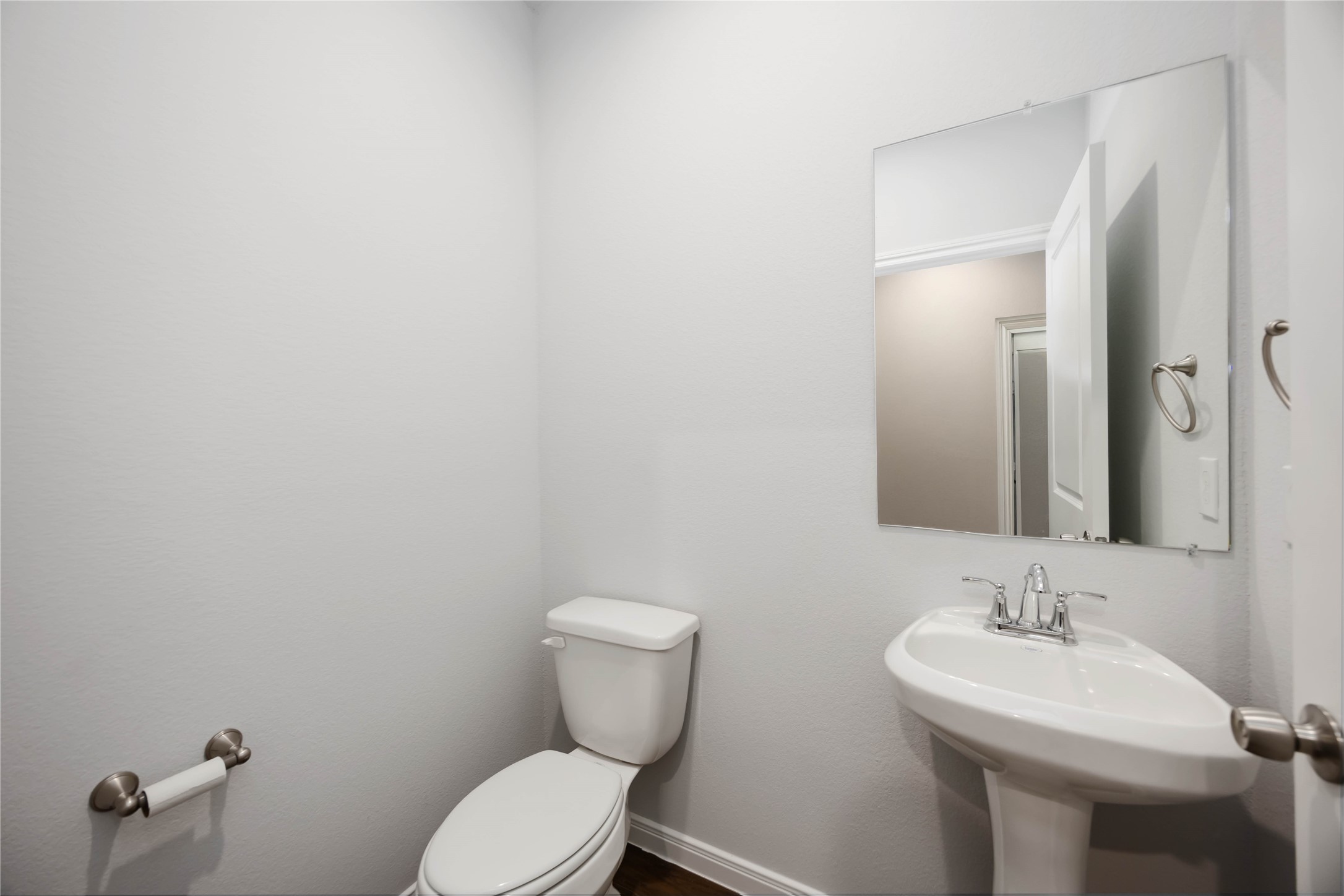 4938 Paradigm Ln Spring Spring, TX 77379 - Photo 11 of 26 a bathroom with a toilet a sink and mirror