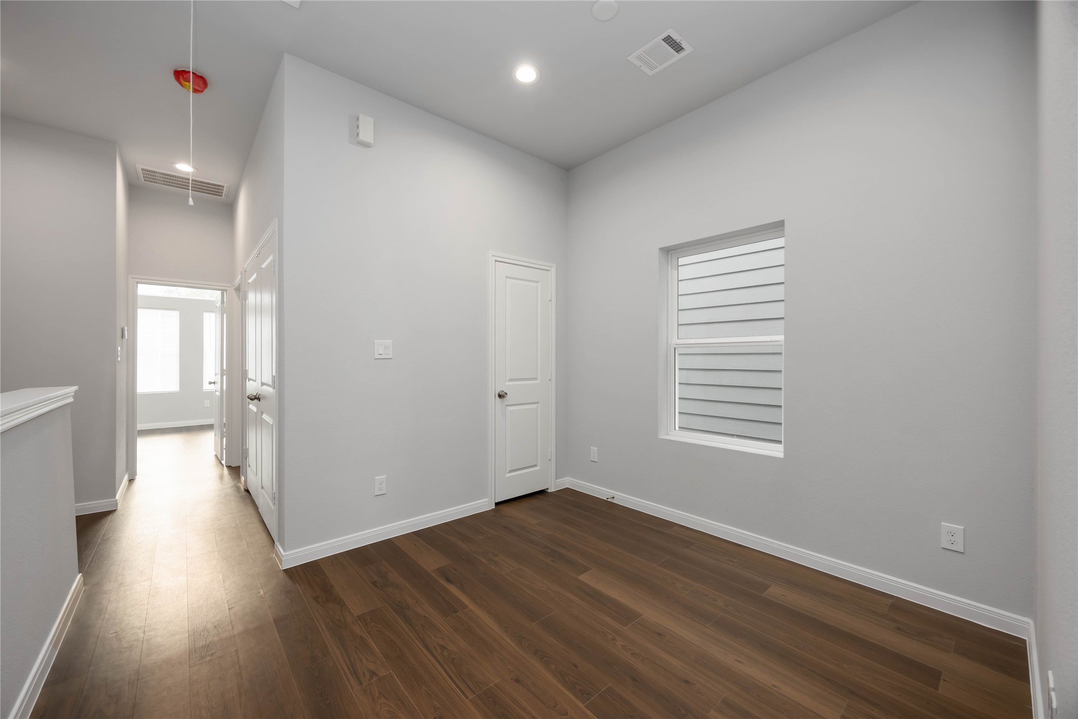 4938 Paradigm Ln Spring Spring, TX 77379 - Photo 15 of 26 a view of a room with wooden floor and window