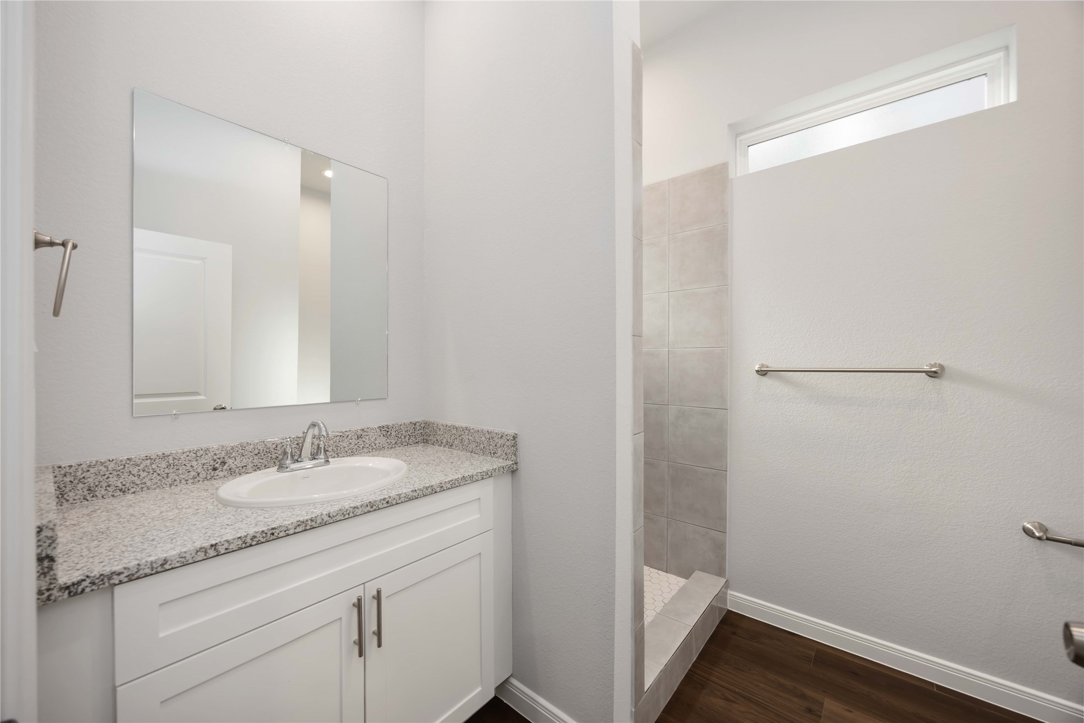 4938 Paradigm Ln Spring Spring, TX 77379 - Photo 21 of 26 a bathroom with a granite countertop sink a toilet and a mirror