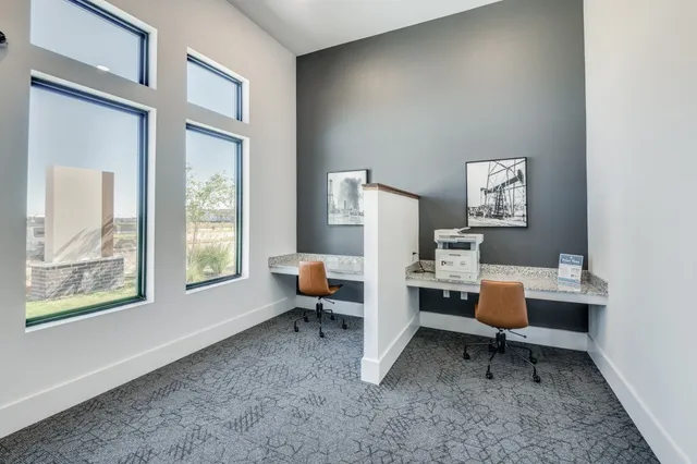 an open kitchen with a table and chairs in it