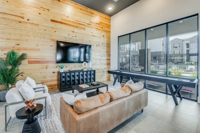 a bedroom with a bed and a large mirror