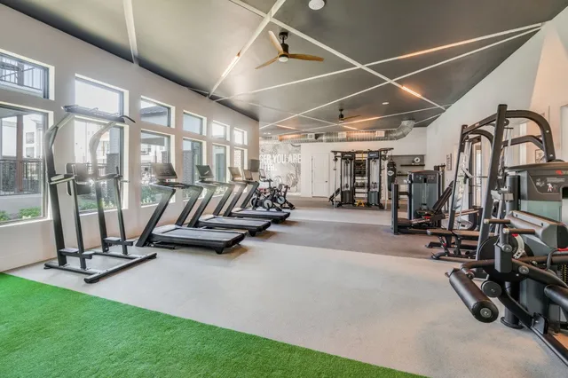 a dining table with chairs and cabinets