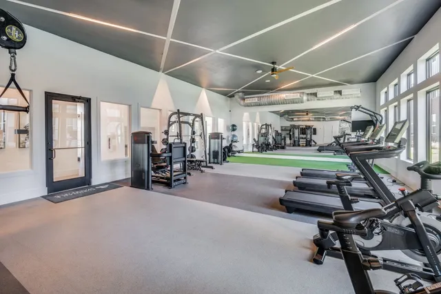 a view of a dining room with furniture and a window