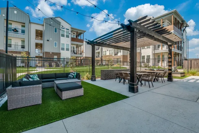a kitchen with a sink and chairs