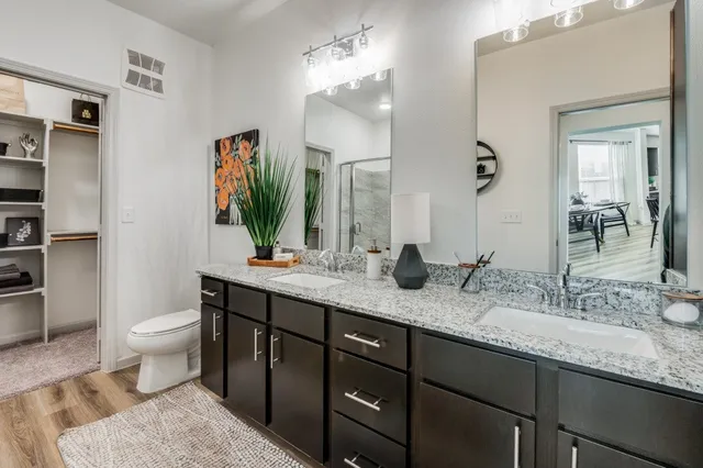 a view of a patio with table and chairs and garden