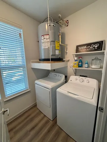 a view of a patio with couches and table and chairs and potted plants