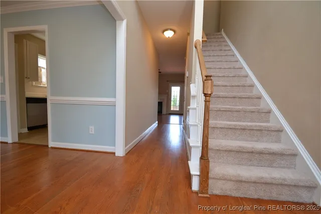 a view of an entryway with wooden floor
