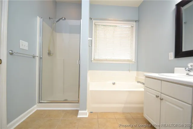 a bathroom with a bathtub and a sink