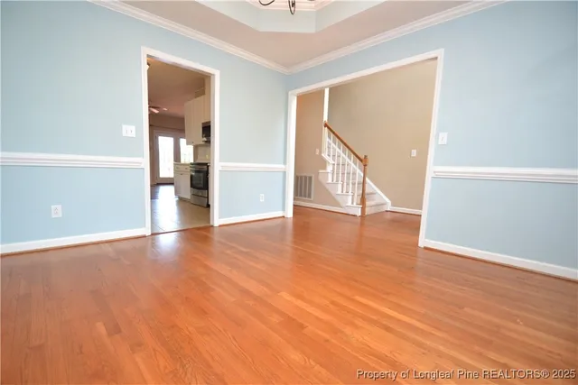 a view of an entryway with wooden floor