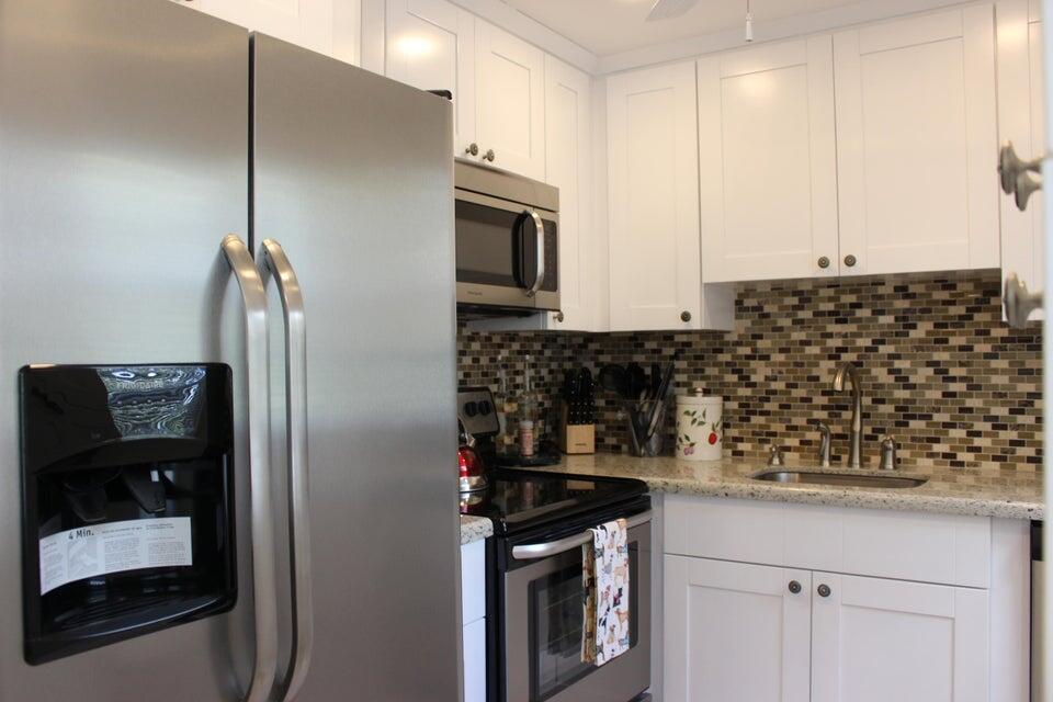 46 Mansfield B Boca Raton, FL 33434 - Photo 1 of 70 a kitchen with stainless steel appliances granite countertop a refrigerator and a stove