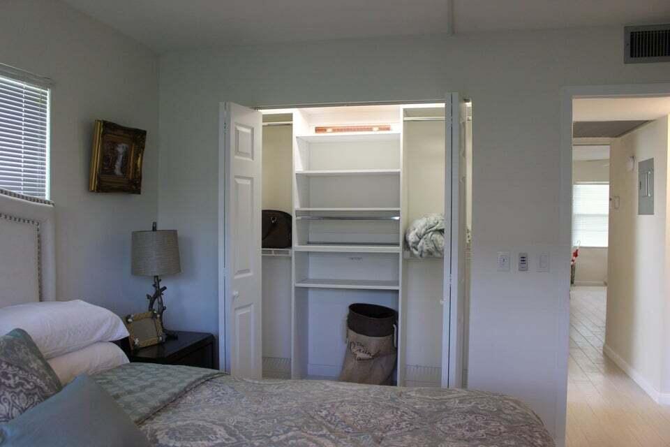 46 Mansfield B Boca Raton, FL 33434 - Photo 11 of 70 a bedroom with a bed and a television