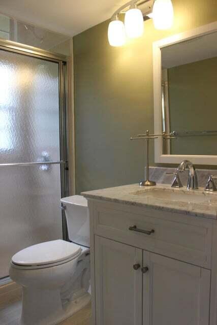 46 Mansfield B Boca Raton, FL 33434 - Photo 12 of 70 a bathroom with a granite countertop sink a toilet and a mirror