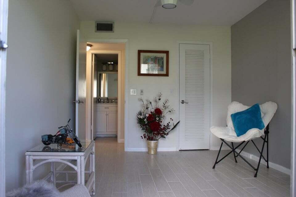 46 Mansfield B Boca Raton, FL 33434 - Photo 19 of 70 a view of a workspace with furniture and wooden floor