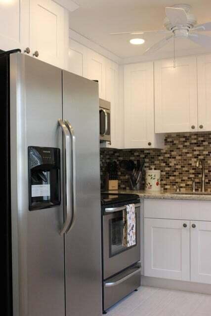 46 Mansfield B Boca Raton, FL 33434 - Photo 2 of 70 a kitchen with stainless steel appliances granite countertop a refrigerator and a stove