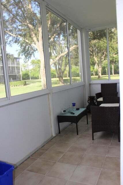 46 Mansfield B Boca Raton, FL 33434 - Photo 23 of 70 a living room with furniture and a window
