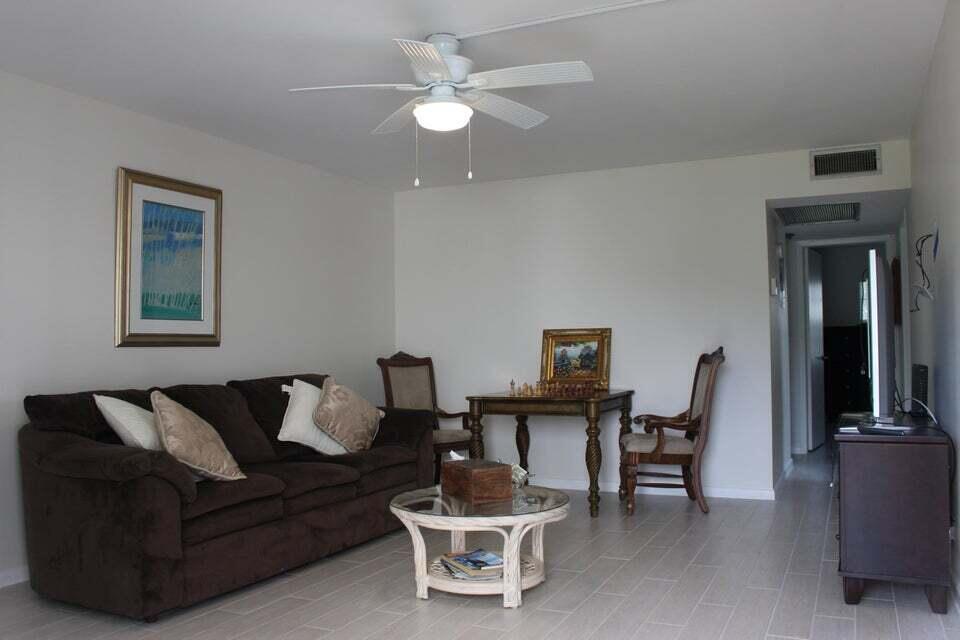 46 Mansfield B Boca Raton, FL 33434 - Photo 6 of 70 a living room with furniture a desk and chair