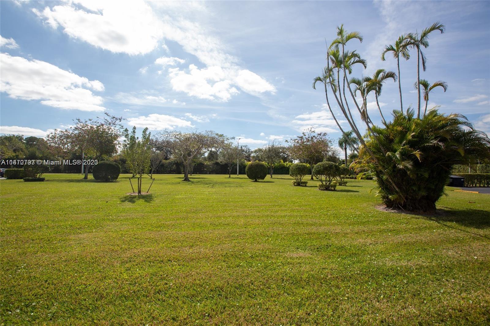 46 Mansfield B Boca Raton, FL 33434 - Photo 65 of 70 a view of a yard with a slide
