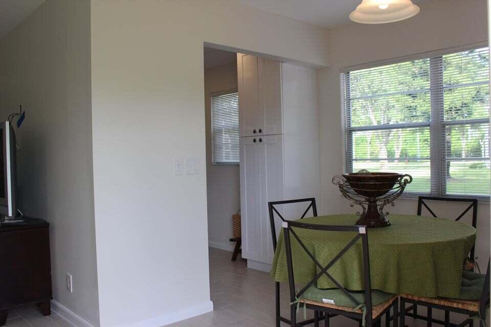 46 Mansfield B Boca Raton, FL 33434 - Photo 9 of 70 a view of a dining room with furniture and a window