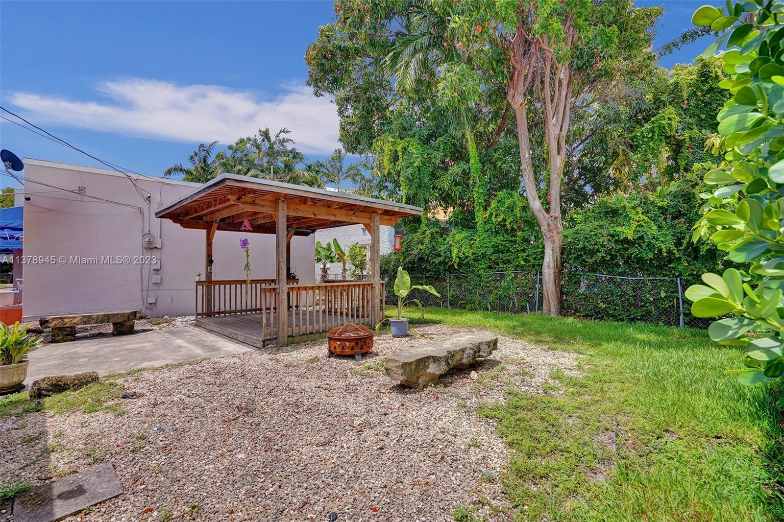 2231 Southwest 17th Street Miami, FL 33145 - Photo 13 of 69 a view of backyard with a barn and large trees
