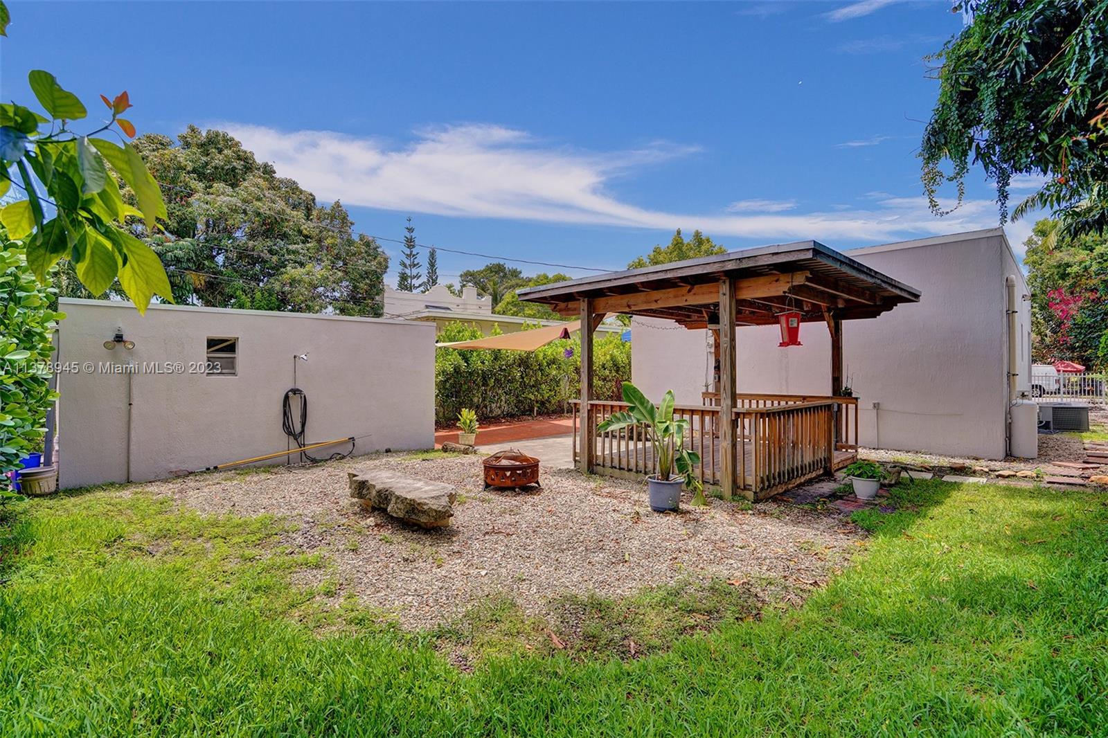 2231 Southwest 17th Street Miami, FL 33145 - Photo 14 of 69 a backyard of a house with barbeque oven table and chairs