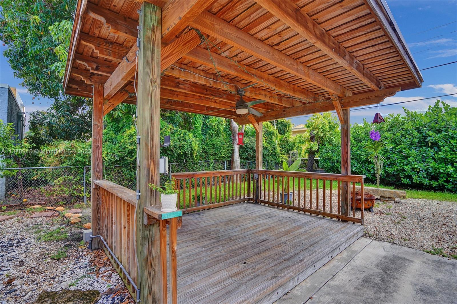 2231 Southwest 17th Street Miami, FL 33145 - Photo 16 of 69 a view of a wooden deck with a yard
