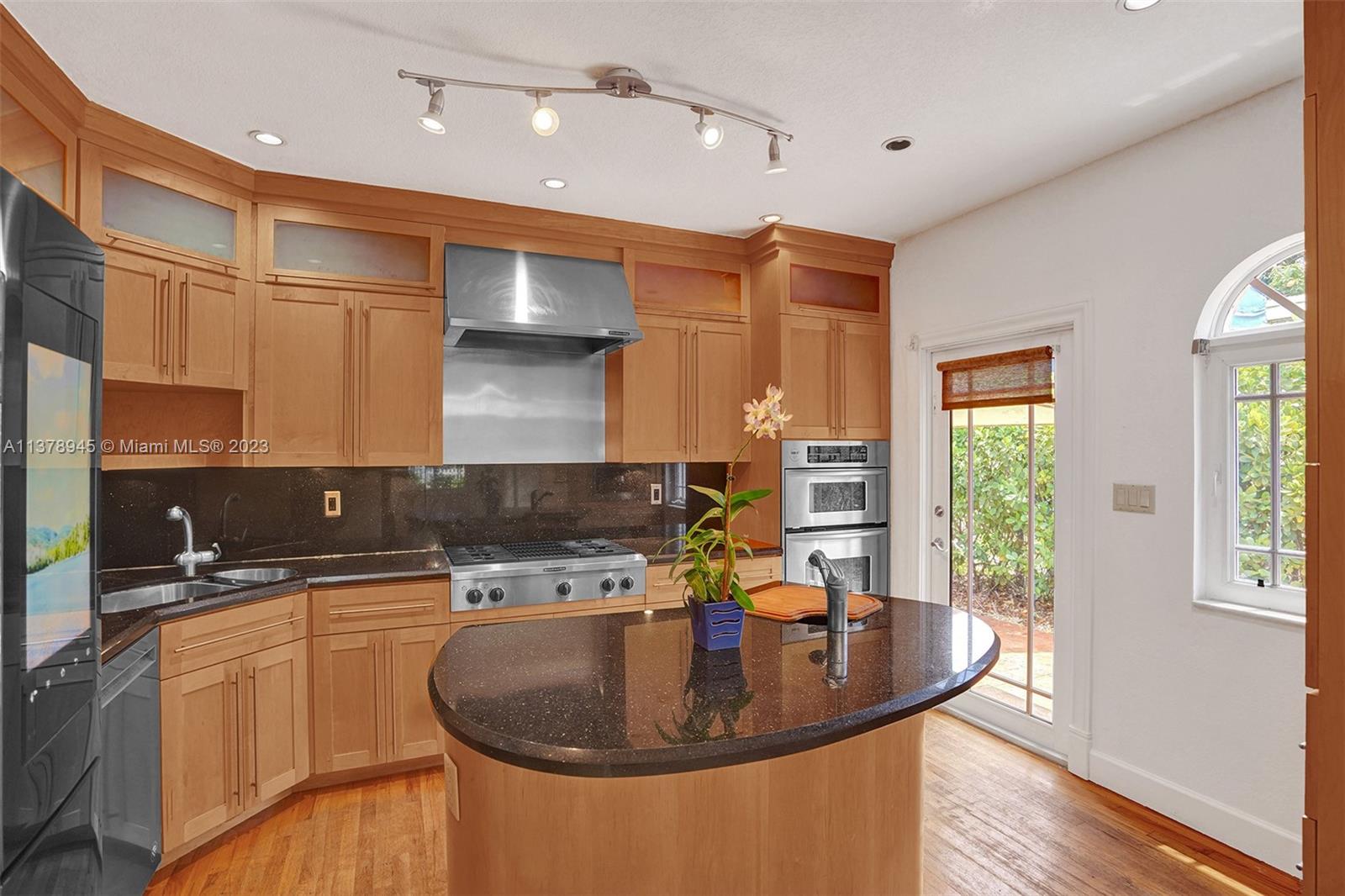 2231 Southwest 17th Street Miami, FL 33145 - Photo 28 of 69 a kitchen with sink a refrigerator and wooden floor