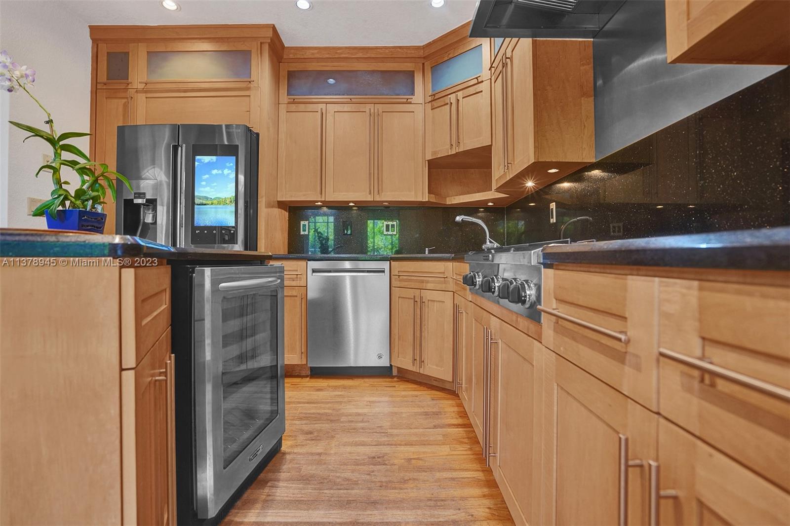 2231 Southwest 17th Street Miami, FL 33145 - Photo 31 of 69 a kitchen with stainless steel appliances a refrigerator and cabinets