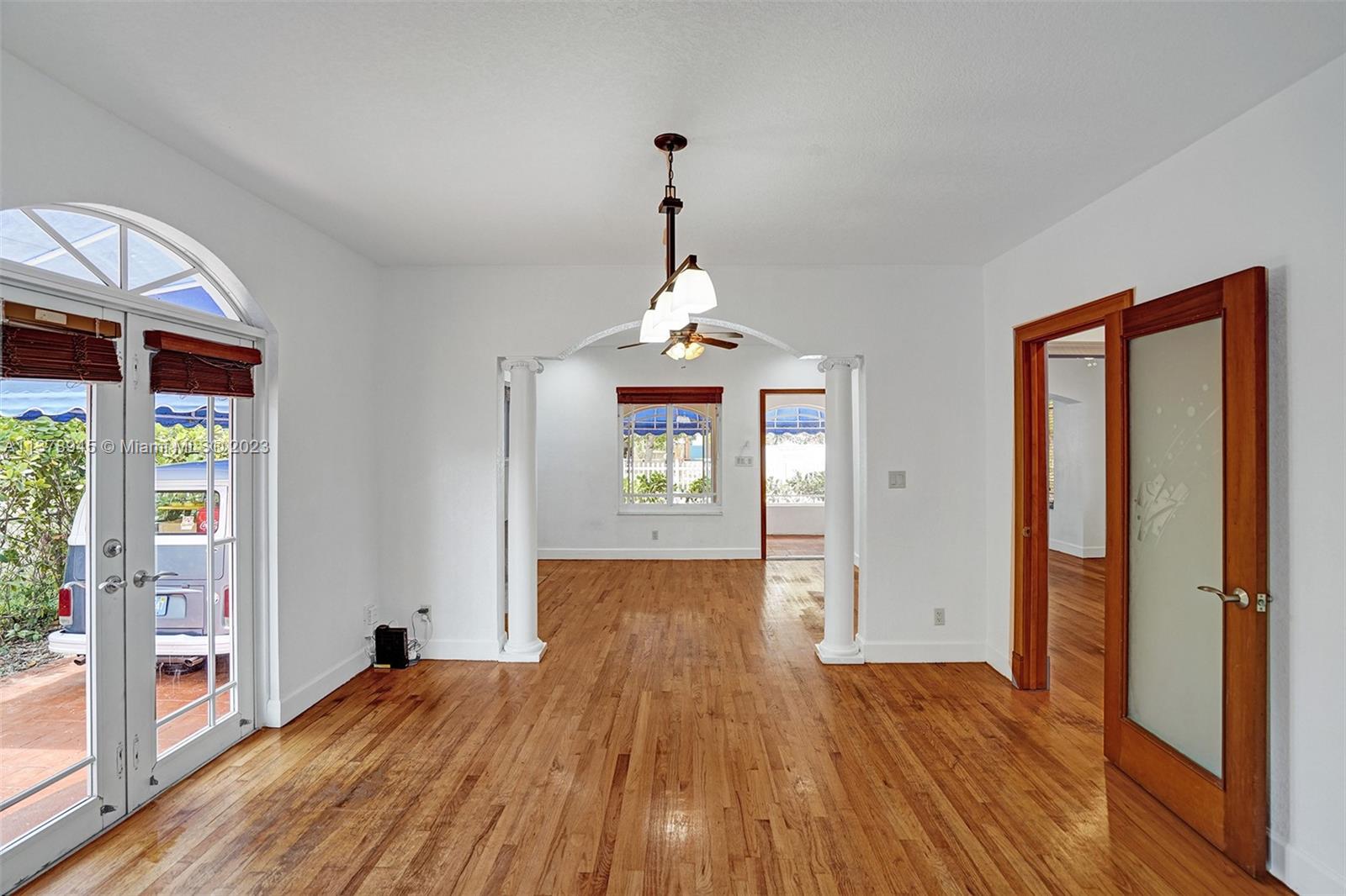 2231 Southwest 17th Street Miami, FL 33145 - Photo 33 of 69 a hallway with wooden floor chandelier and entryway