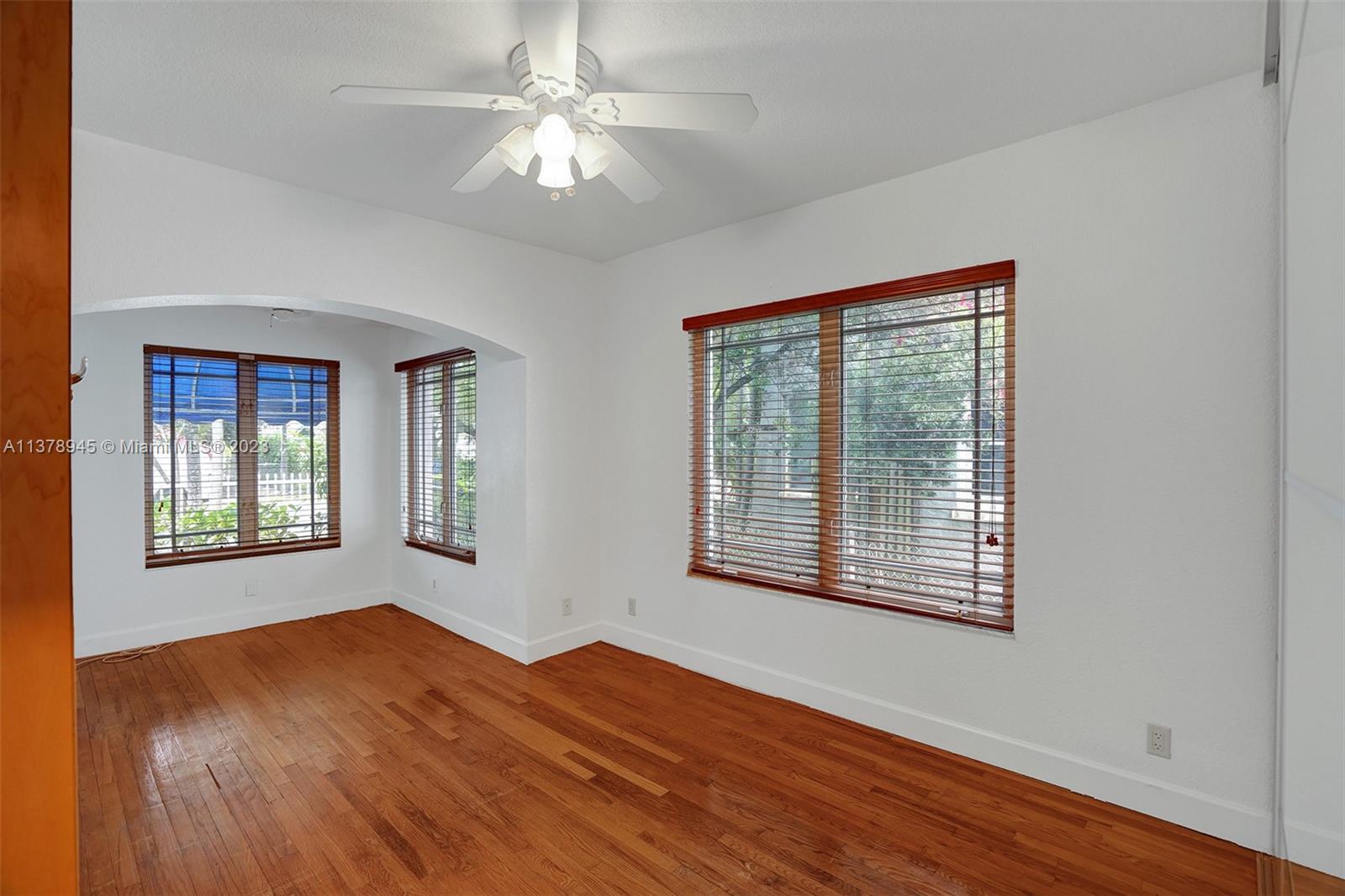 2231 Southwest 17th Street Miami, FL 33145 - Photo 35 of 69 a view of an empty room with wooden floor and a window
