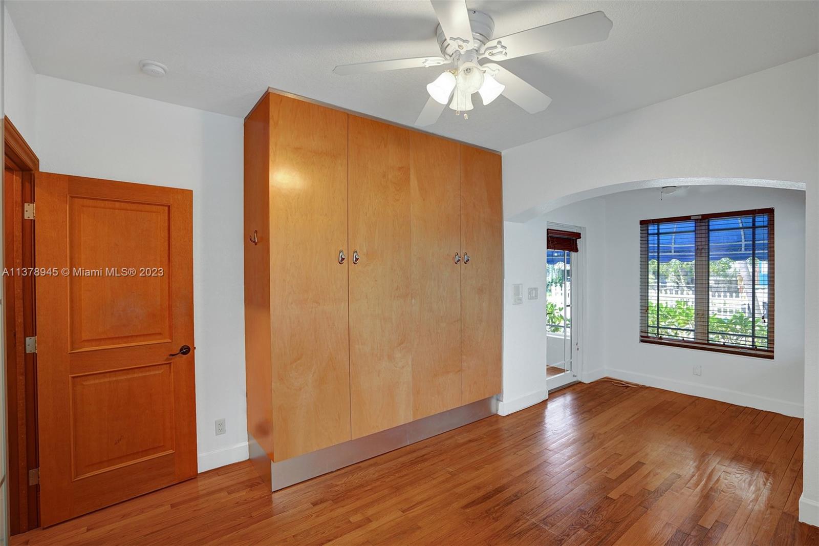 2231 Southwest 17th Street Miami, FL 33145 - Photo 36 of 69 a view of an empty room with window and wooden floor