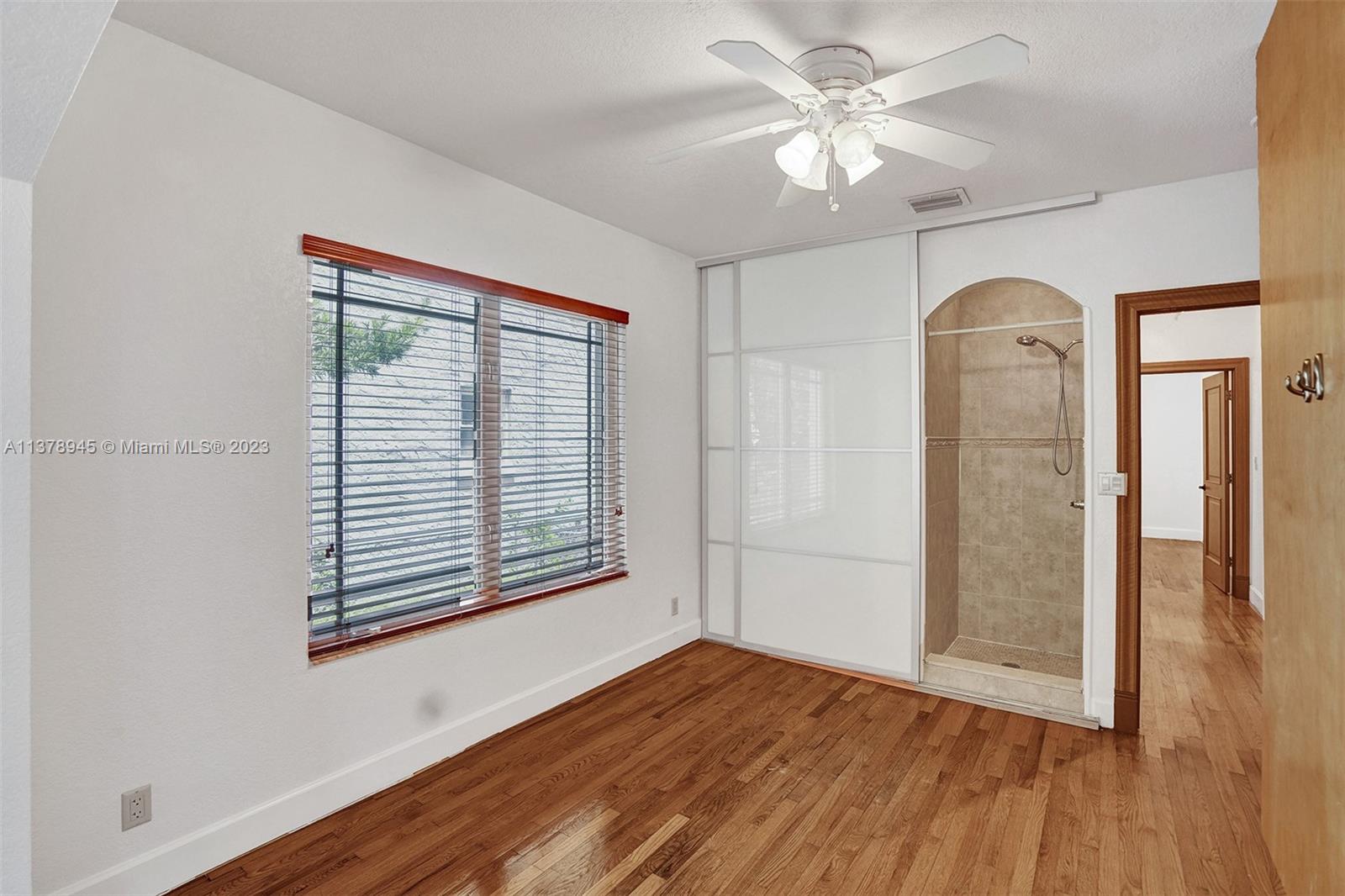 2231 Southwest 17th Street Miami, FL 33145 - Photo 40 of 69 a view of empty room with wooden floor and fan