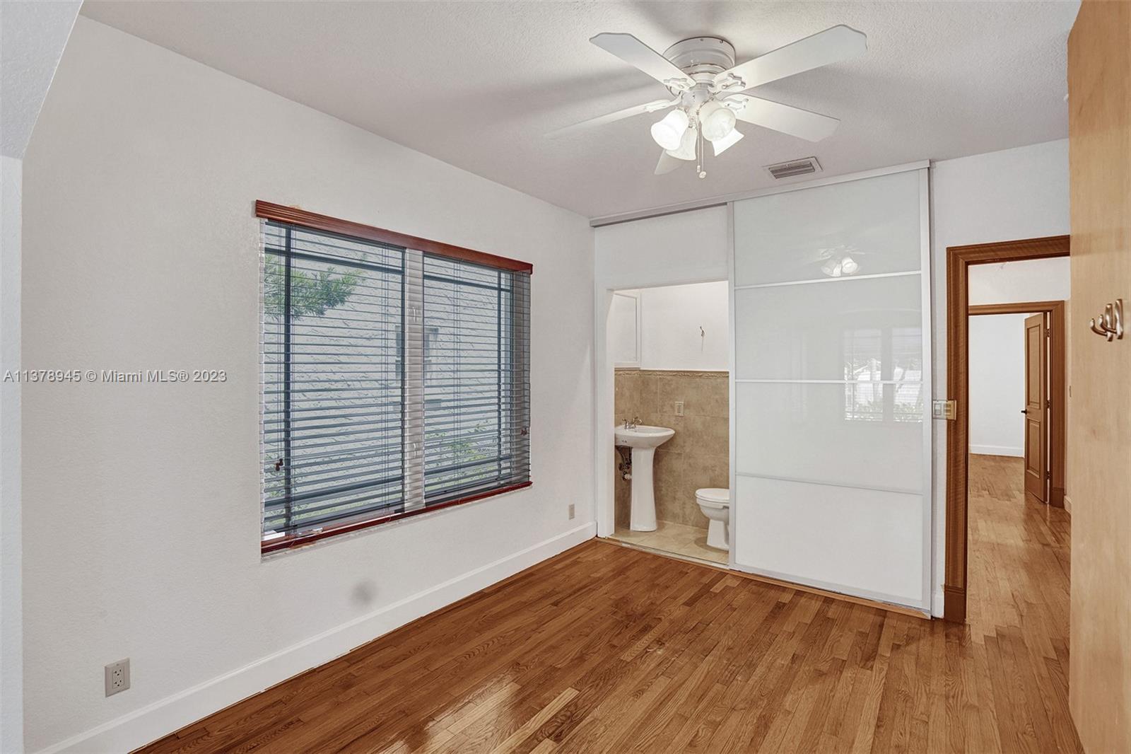 2231 Southwest 17th Street Miami, FL 33145 - Photo 42 of 69 a view of empty room with wooden floor and fan