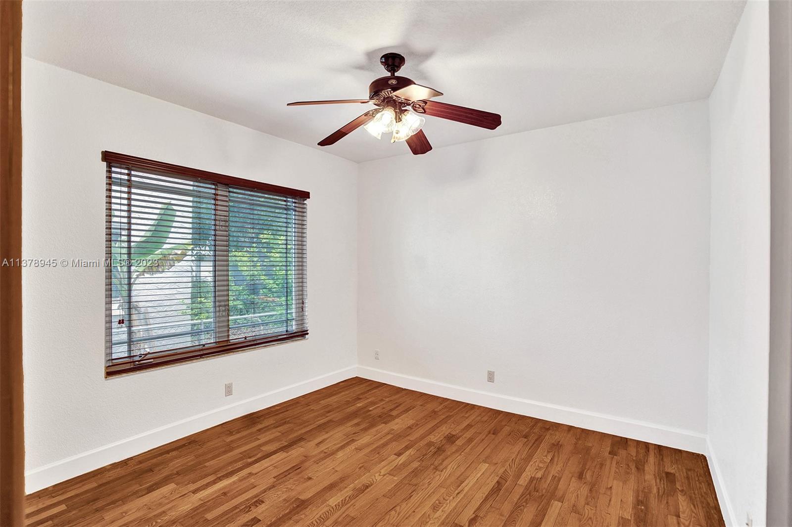 2231 Southwest 17th Street Miami, FL 33145 - Photo 46 of 69 a view of empty room with wooden floor and fan