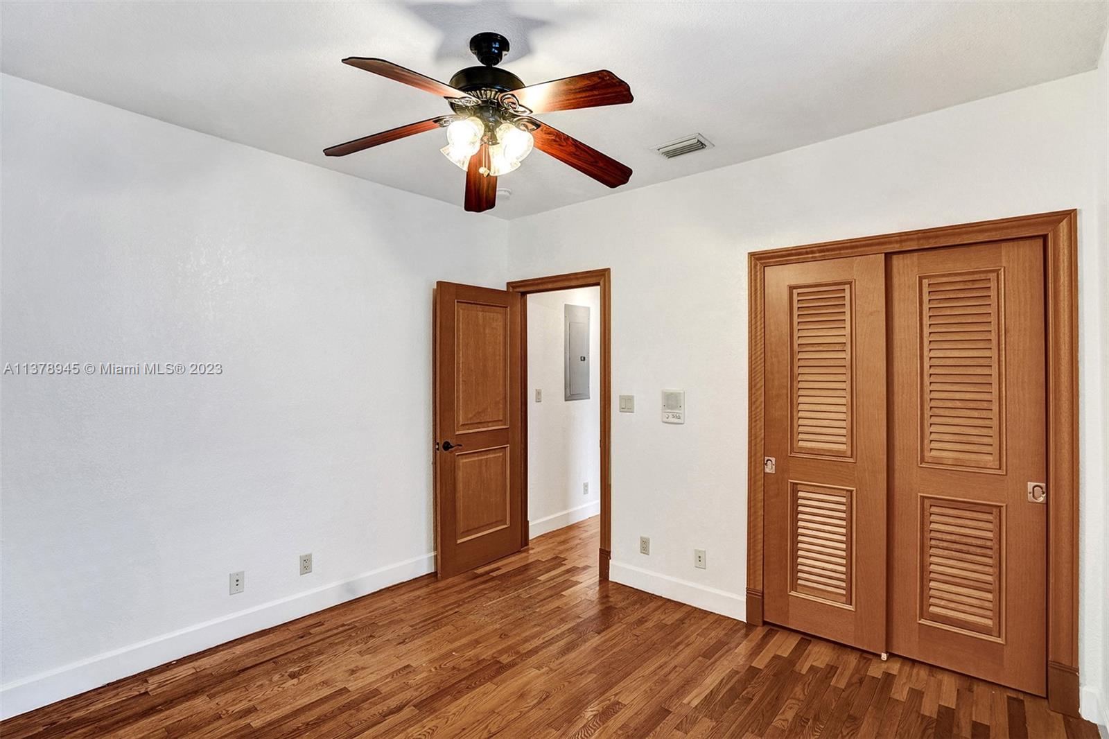 2231 Southwest 17th Street Miami, FL 33145 - Photo 48 of 69 wooden floor in an empty room with a window