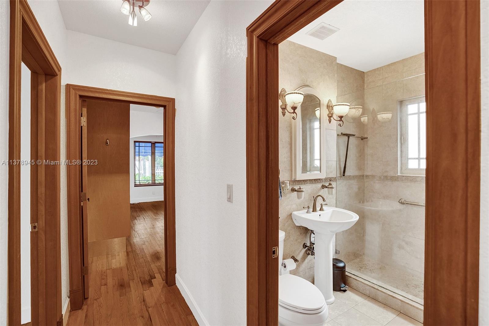 2231 Southwest 17th Street Miami, FL 33145 - Photo 49 of 69 a bathroom with a sink and a mirror