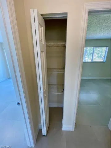 a white toilet sitting next to a bath tub and a shower