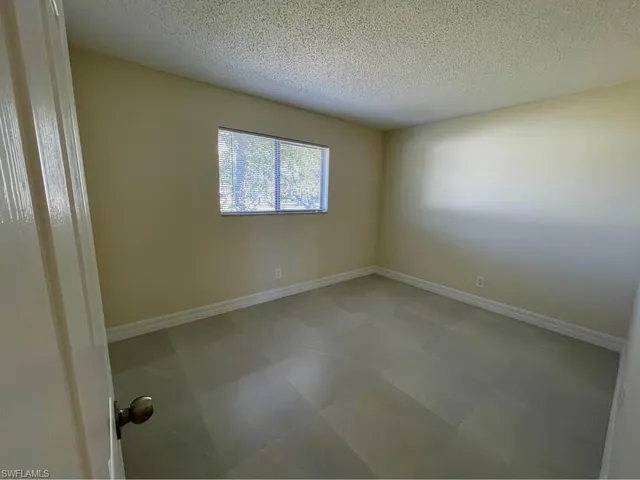 an empty room with a door