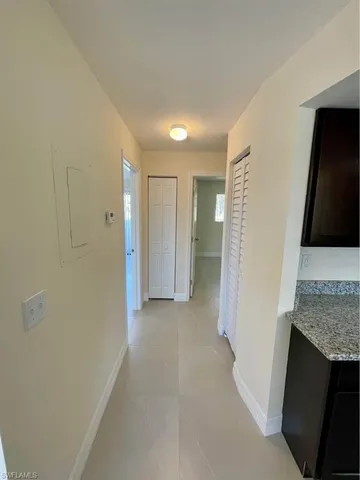 a view of hallway with wooden floor