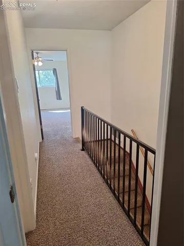 a view of a hallway with windows